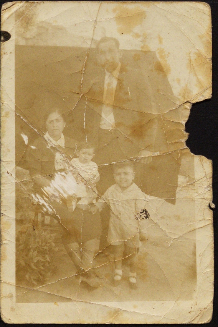A family photo of two people and two children

Description automatically generated