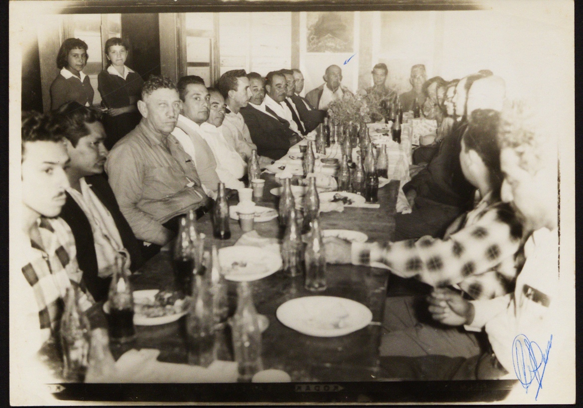 A group of people sitting at a table

Description automatically generated