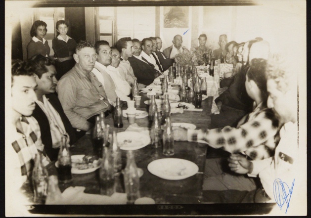 A group of people sitting at a table

Description automatically generated
