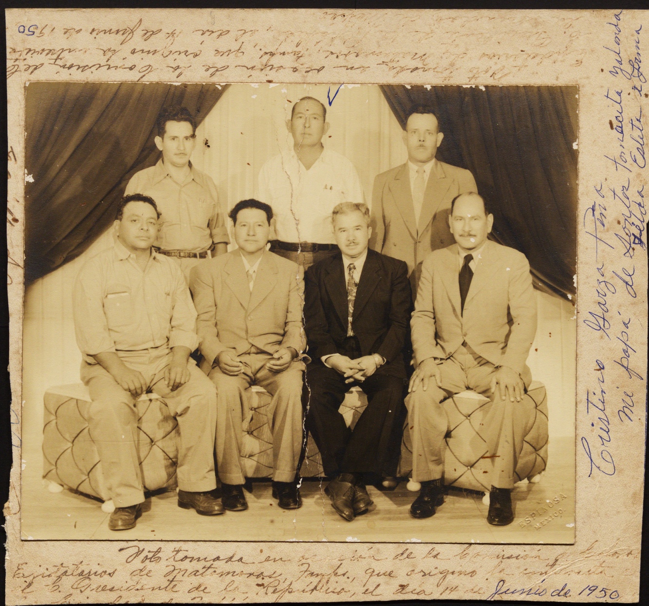 A group of men posing for a photo

Description automatically generated