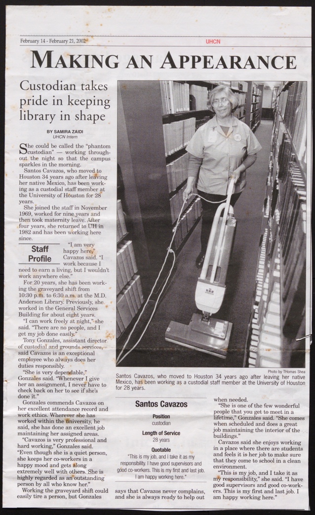 A person vacuuming a library

Description automatically generated