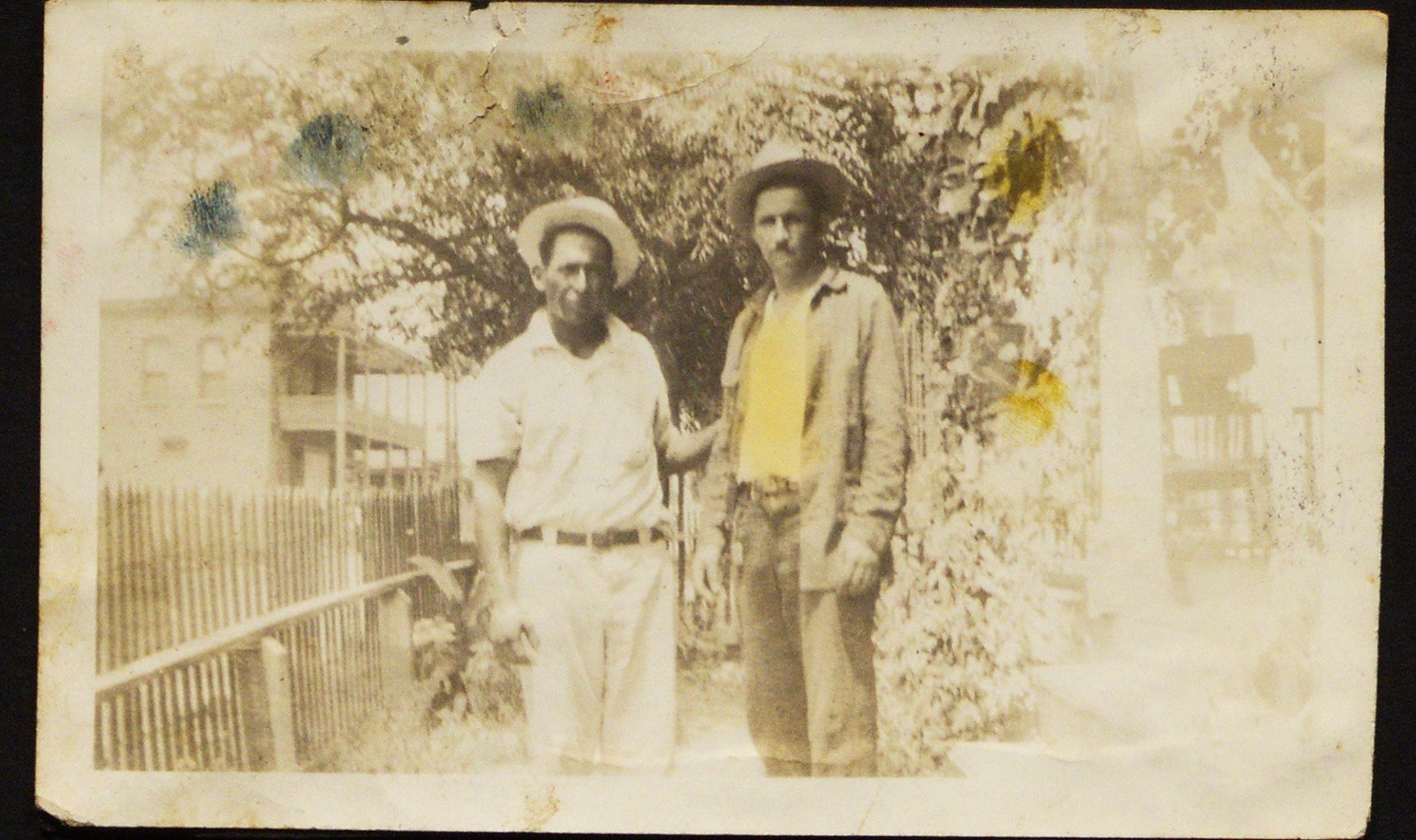 A couple of men standing together

Description automatically generated